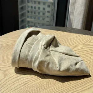 Detailed view of British vintage pleated suede bucket hat for women, elegant winter warm basin hat.