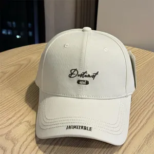 Classic white baseball cap for women and men, stylish curved brim streetwear hat.