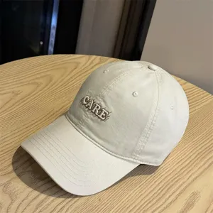 Stylish women's baseball cap with letter embroidery, casual cotton sun hat for outdoor travel spring.