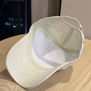 Classic curved brim baseball hat interior detail shot, casual cotton cap lining and structure.