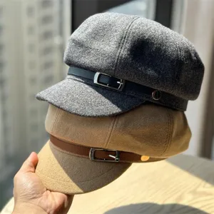 Detailed view of the stylish wool newsboy cap, warm retro beret with sleek belt and buckle design.