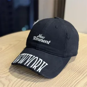 Black washed vintage baseball cap with letter embroidery, distressed street style design.
