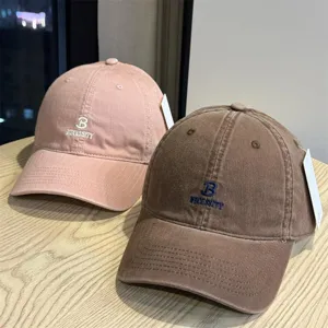 Casual washed cotton baseball cap with stylish letter embroidery, unisex sun hat design.