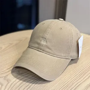 Japanese style washed cotton baseball cap with minimalist front embroidery for casual wear.
