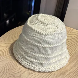 Detailed close-up showing the cozy knit texture and design of the winter bucket hat.