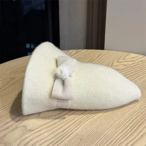 Chic women knitted hat detail, solid color winter warm cloche hat with cute bow and pom-pom.