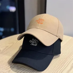 Embroidered letter baseball cap, stylish couple hat with classic design for daily wear.