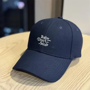 Navy blue embroidered baseball cap with letter design, casual style for everyday wear.