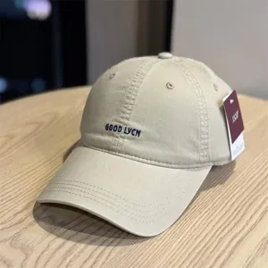 Vintage washed cotton baseball cap with embroidered letters, casual adjustable sun hat.