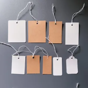 Blank kraft paper hang tags with white elastic strings, perfect for DIY pricing and labeling.