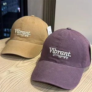 Detail view of stylish deep-crown baseball caps featuring exquisite front embroidery text.