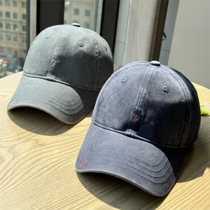Vintage washed cotton baseball cap with embroidered letter design, casual sun protection hat.