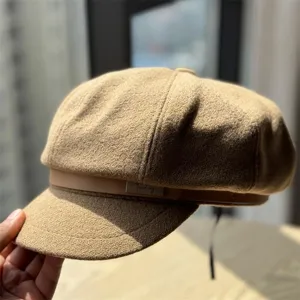 Detail view of the classic retro wool blend newsboy hat with stylish belt buckle accent.