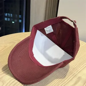 Burgundy cotton baseball cap interior detail view, deep crown design for casual wear.