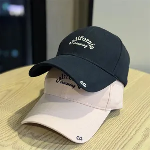 Vintage style women's baseball cap with soft top and wide brim, stylish casual sun hat.
