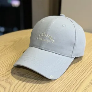 Light blue baseball cap detail, soft top curved brim, casual cotton embroidered hat.