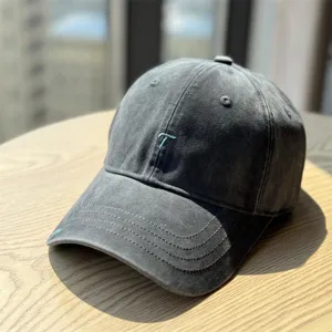 Vintage washed cotton baseball cap with embroidered letter T, casual sun protection hat.