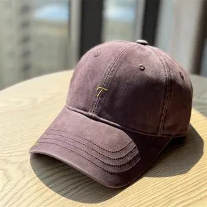 Washed cotton baseball cap detailed view, vintage embroidered letter design for casual style.