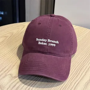 Classic washed cotton baseball cap with stylish front embroidery, comfortable fit for daily wear.