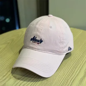 Pink casual soft top baseball cap featuring embroidered front lettering and curved brim.