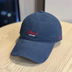 Classic navy blue baseball cap with embroidered News New York text design for daily wear.