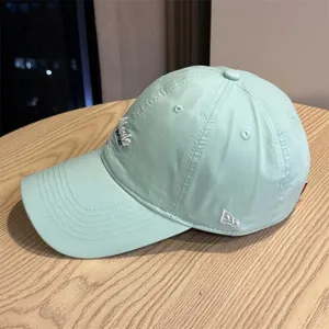 Mint green casual baseball cap with front embroidery, soft crown outdoor sun protection hat.