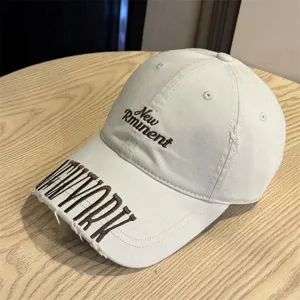 Vintage washed baseball cap with distressed brim and stylish brown embroidery for daily wear.