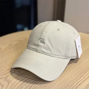 Washed cotton baseball cap for men and women, featuring stylish letter embroidery.