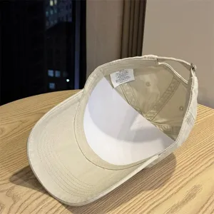 Detailed view of the casual washed cotton baseball cap inner structure and adjustable strap.