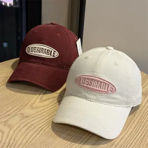 Classic washed cotton baseball cap with embroidered oval logo, casual soft top hat for daily wear.