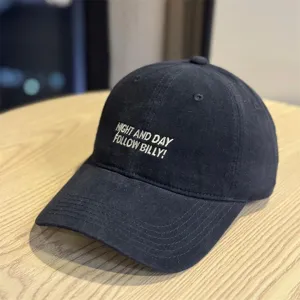Washed black baseball cap with front embroidery text, casual retro soft top hat for daily wear.