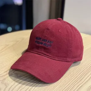 Vintage washed cotton baseball cap with stylish front embroidery, comfortable fit for daily wear.