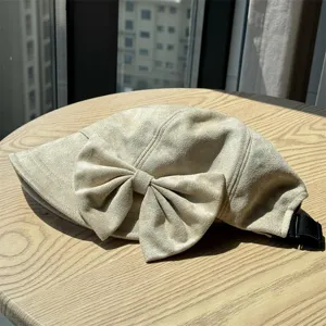 Japanese vintage style pleated newsboy hat with bow detail, autumn fashion accessory.