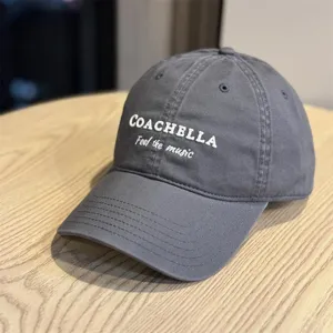 Grey baseball cap with embroidered Coachella letter detail, casual stylish cotton duck hat.