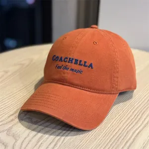 Orange embroidered baseball cap with Coachella letter detail, casual streetwear style.