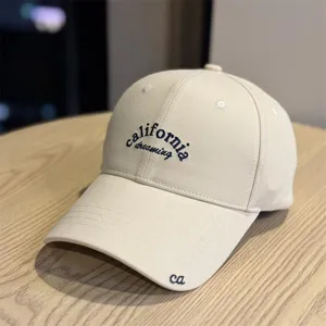 Detail view of the beige vintage baseball cap with California Dreaming embroidery.