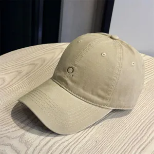 Detail view of the Japanese minimalist embroidered baseball cap with soft top and wide brim.