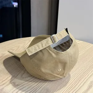 Detailed view of khaki minimalist casual baseball cap with adjustable metal buckle strap.