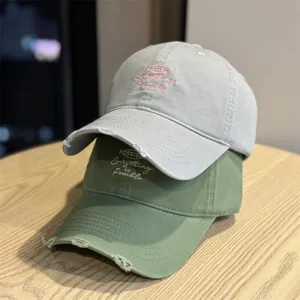Classic cotton baseball cap with embroidered lettering, casual sun protection dad hat for men and women.