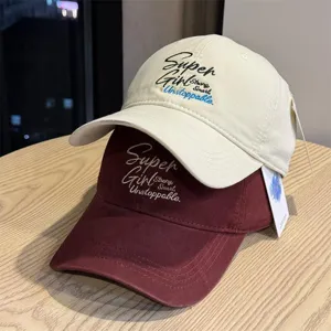 Casual embroidered baseball cap for men and women, soft top curved brim hat in detail view.