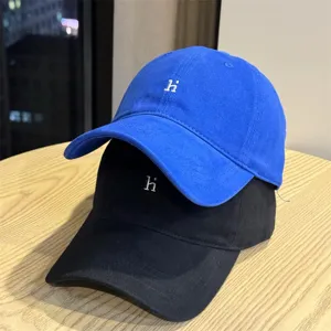 Washed cotton baseball cap detail, casual soft top dad hat with letter embroidery for daily wear.