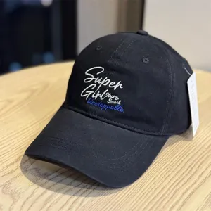 Black embroidered baseball cap detail showing soft top and stylish English lettering.
