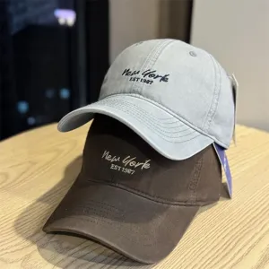 Classic cotton baseball cap with stylish front embroidery, comfortable and sun-protective.