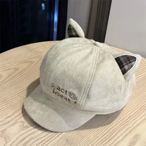 Detailed close-up of cute cat ear suede beret showing exquisite embroidery and plaid ears.