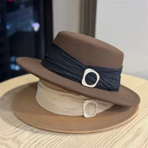 Detailed close-up of retro British style wool felt fedora hats with elegant rhinestone buckles.