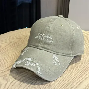 Distressed baseball hat for women and men, vintage embroidered sun cap with curved brim.
