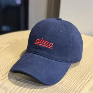 Dark blue embroidered baseball cap with red aime letter, wide brim and soft crown design.
