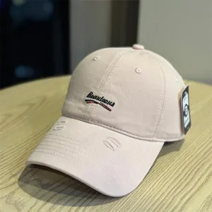 Pink washed baseball cap for women and men, vintage distressed dad hat with chic front embroidery.