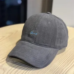 Grey corduroy baseball cap with blue Don't embroidery, casual soft top sun hat detail.