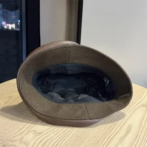 Brown foldable bucket hat for women, casual sun protection hat with inner lining detail.